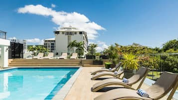 Outdoor pool, pool umbrellas, sun loungers