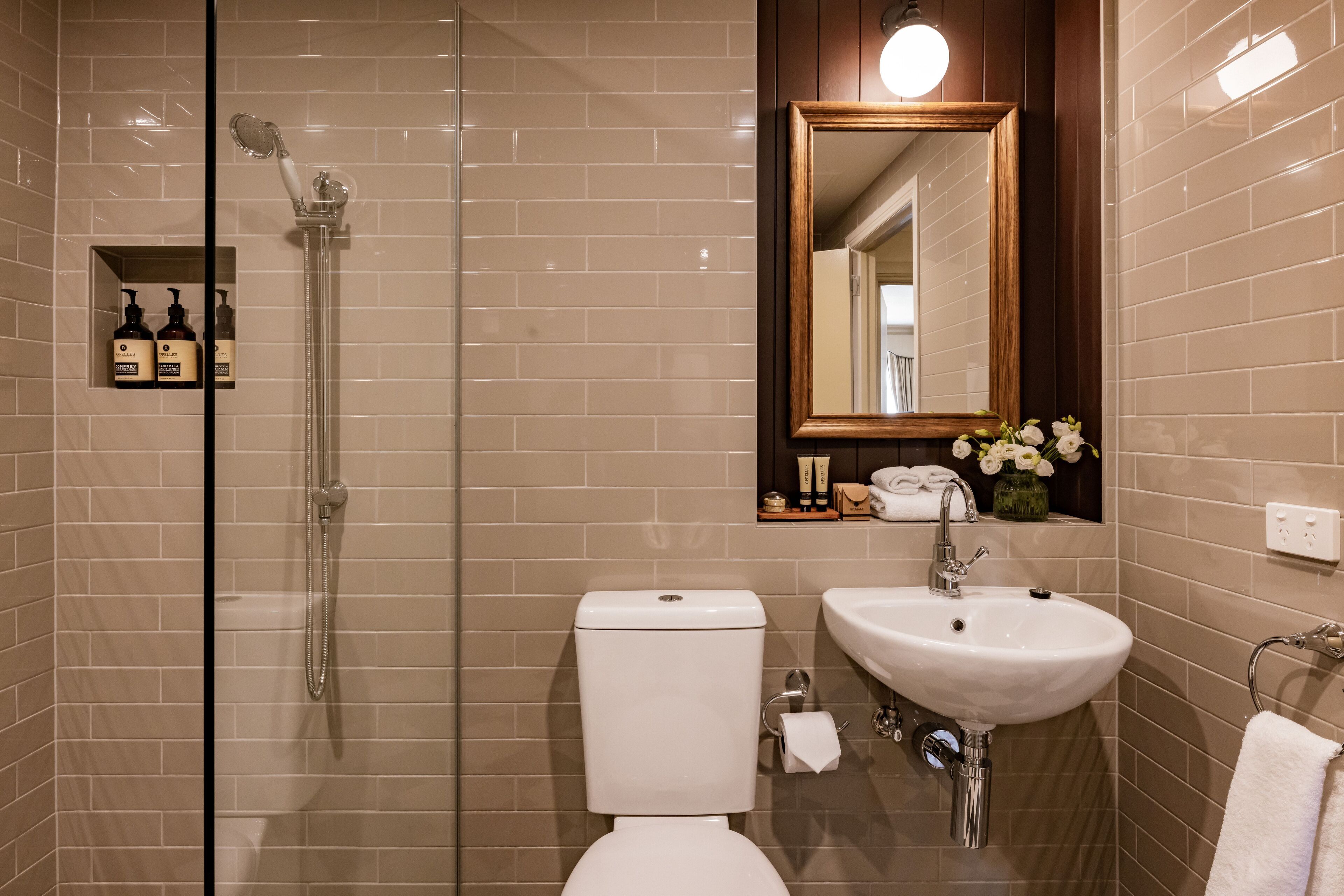 designer toiletries, hair dryer, towels