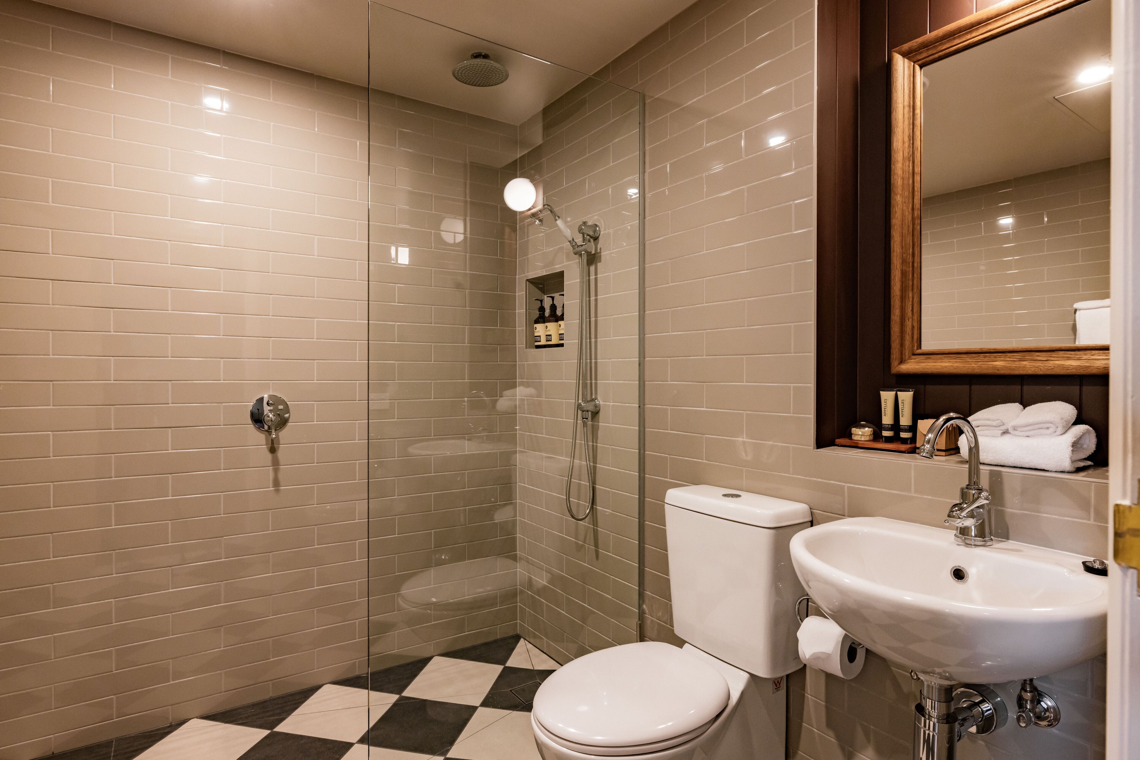 designer toiletries, hair dryer, towels