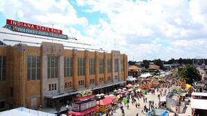 A large building with a sign for Indiana State Fair and Indiana Farmers Coliseum. - Holiday Inn Express Indianapolis-Fishers by IHG (Fishers)