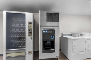 A modern ice dispenser and a vending machine with multiple drink options. - Red Roof Inn Globe - Miami, AZ (Miami)