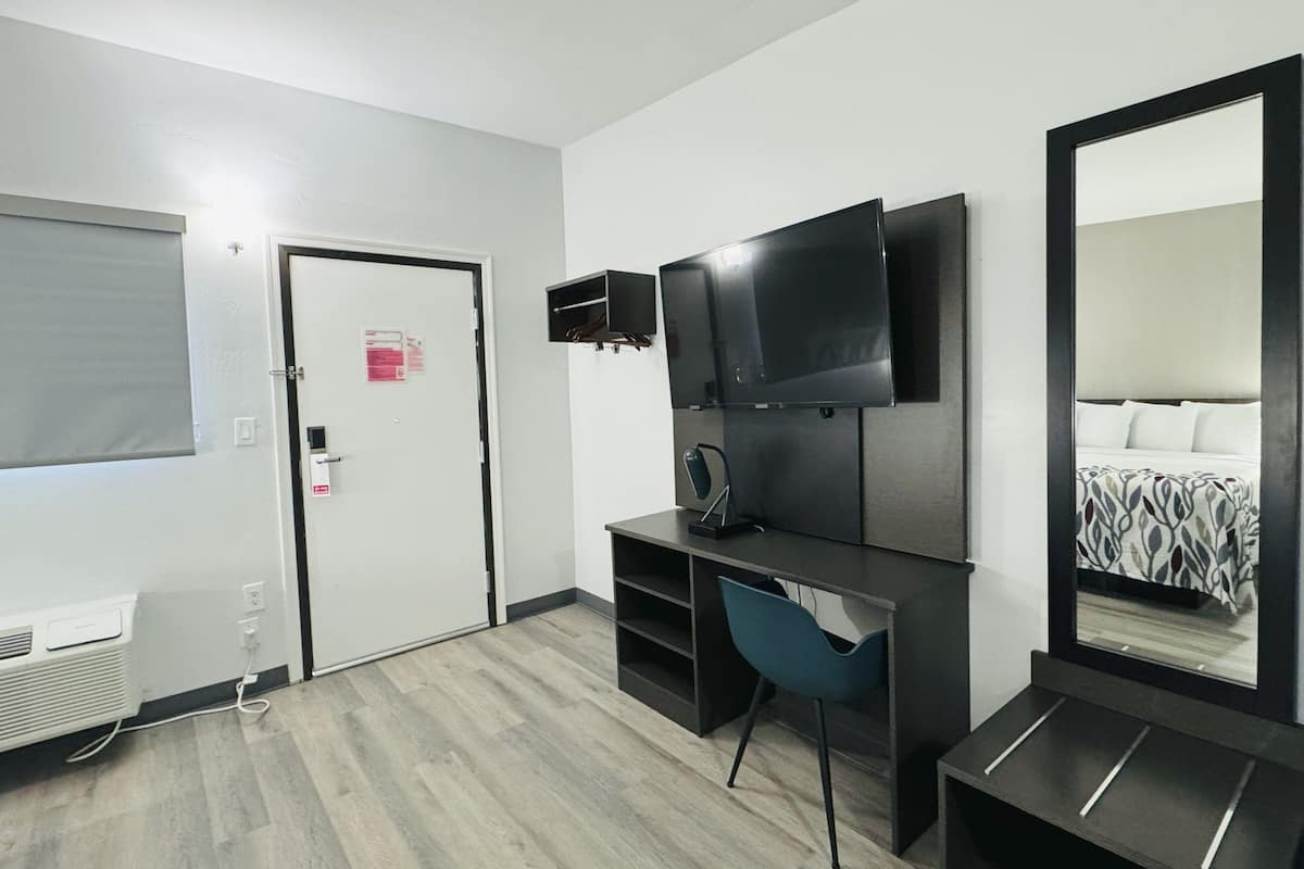 Desk, laptop workspace, blackout curtains, free WiFi