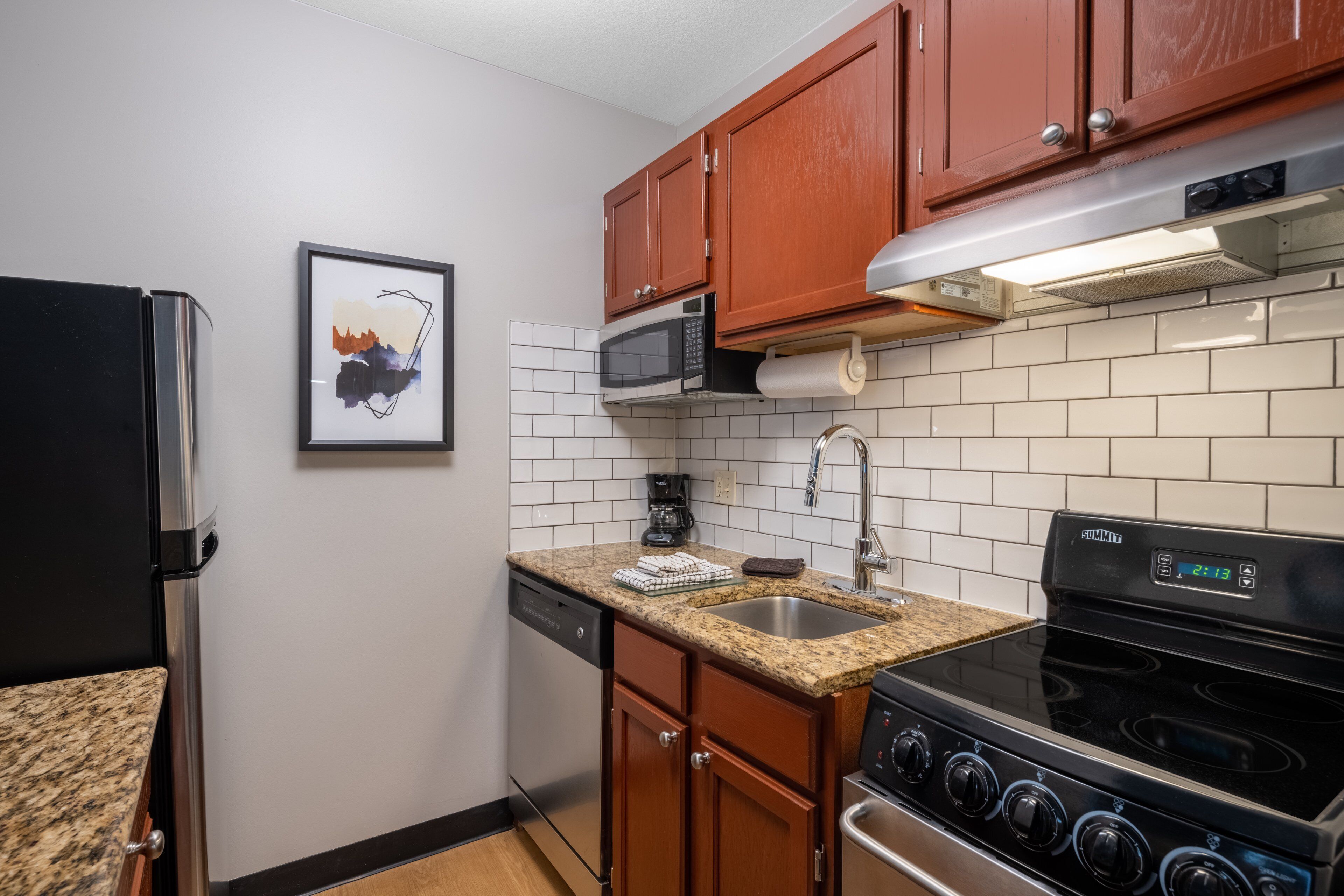 full-sized fridge, microwave, oven, stovetop