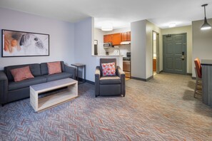 Premium bedding, desk, laptop workspace, blackout drapes