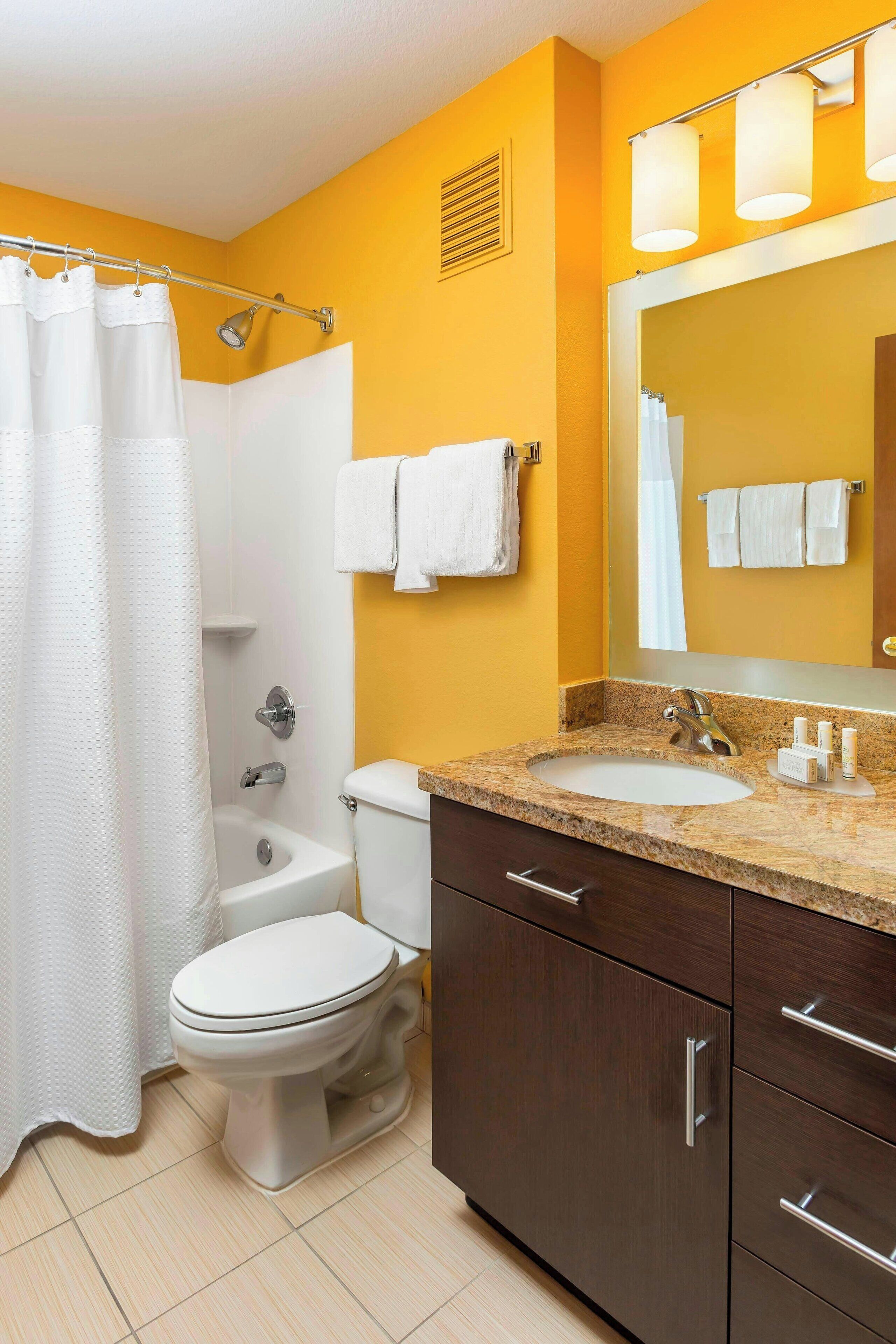 combined shower/bathtub, hair dryer, towels, soap