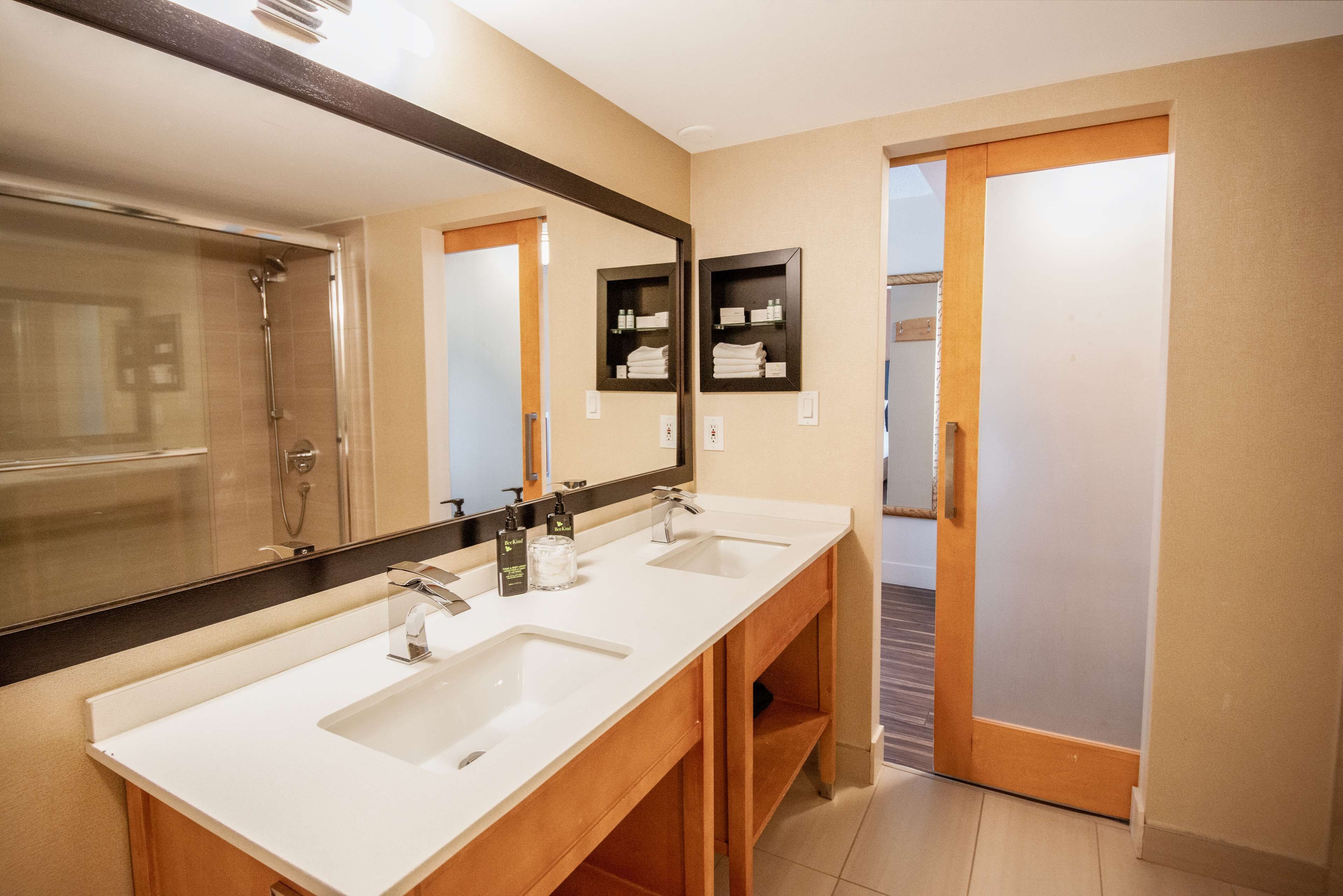 premium room (coast premium two queens) | bathroom | hair dryer, towels
