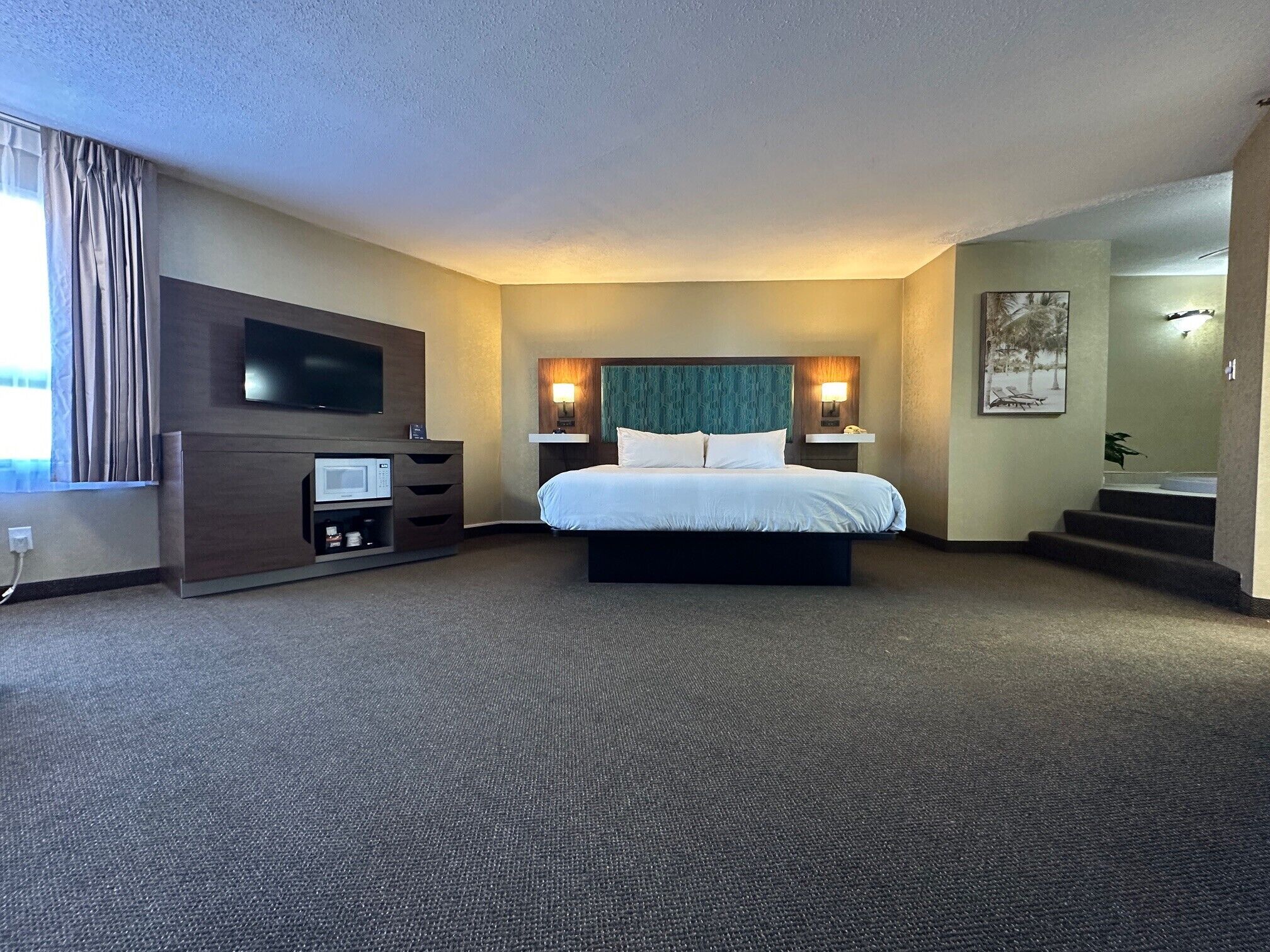 Signature Suite, 1 King Bed, Non Smoking, Jetted Tub | Desk, blackout drapes, iron/ironing board, free WiFi