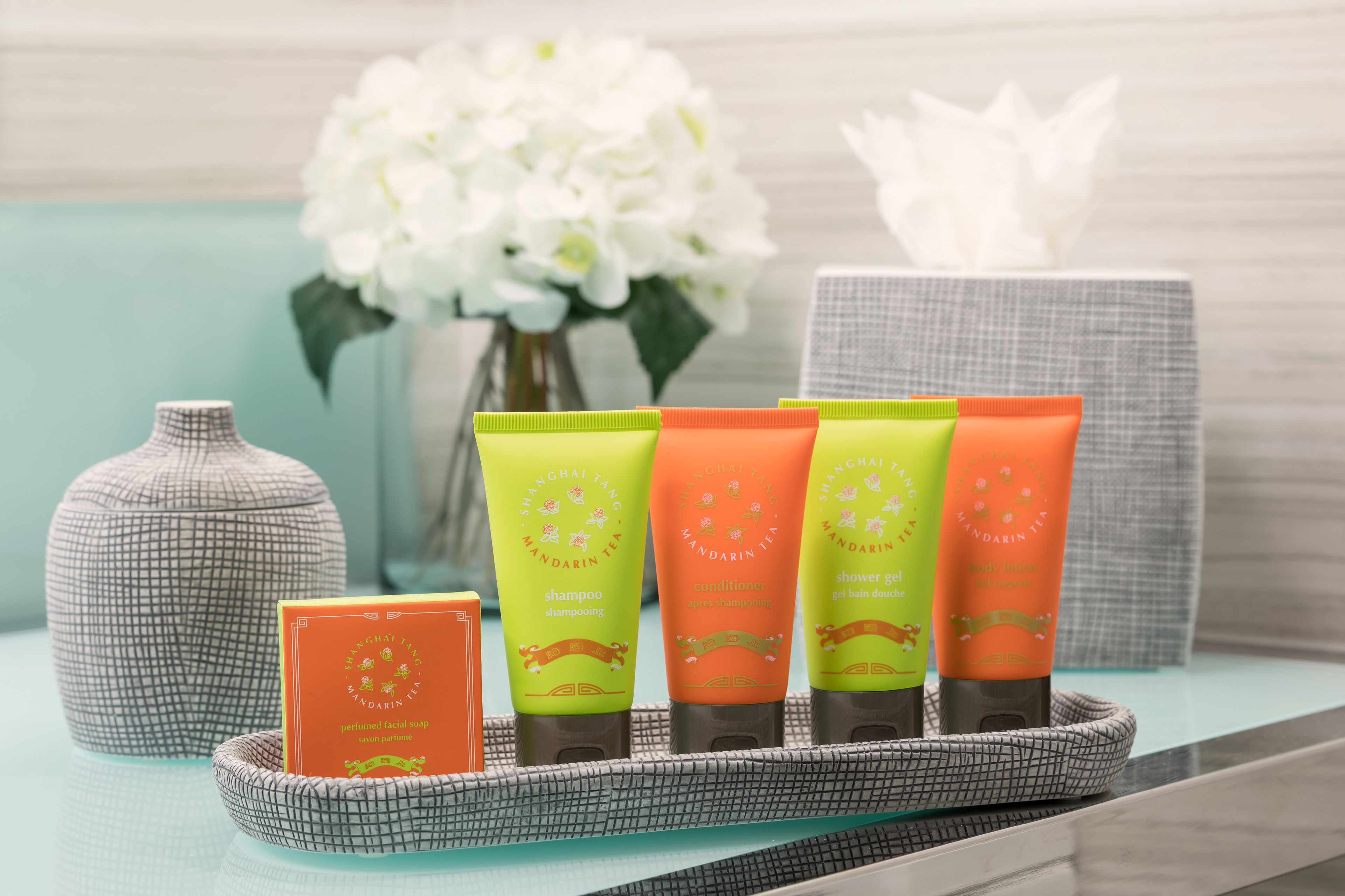 designer toiletries, hair dryer, towels