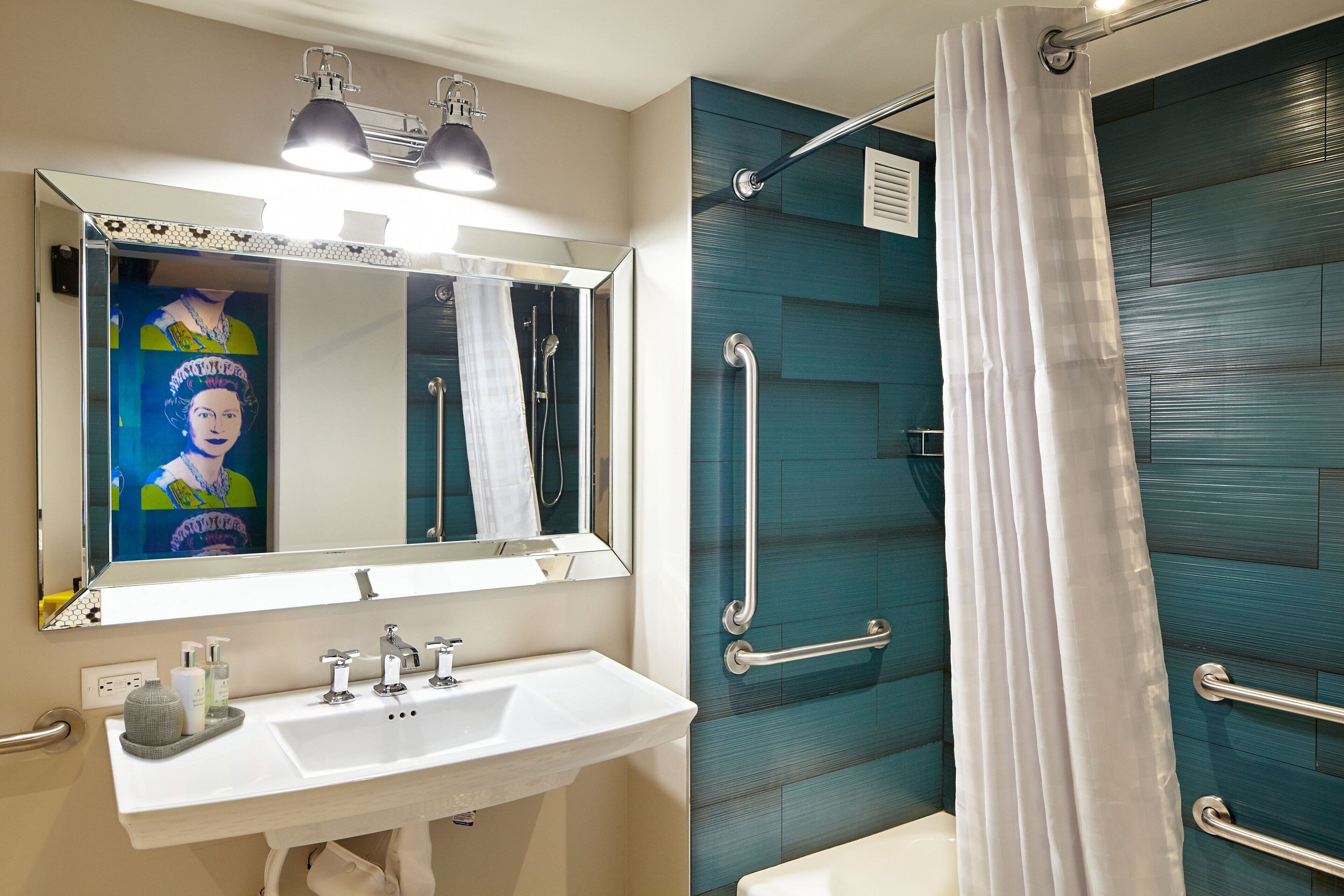 designer toiletries, hair dryer, towels