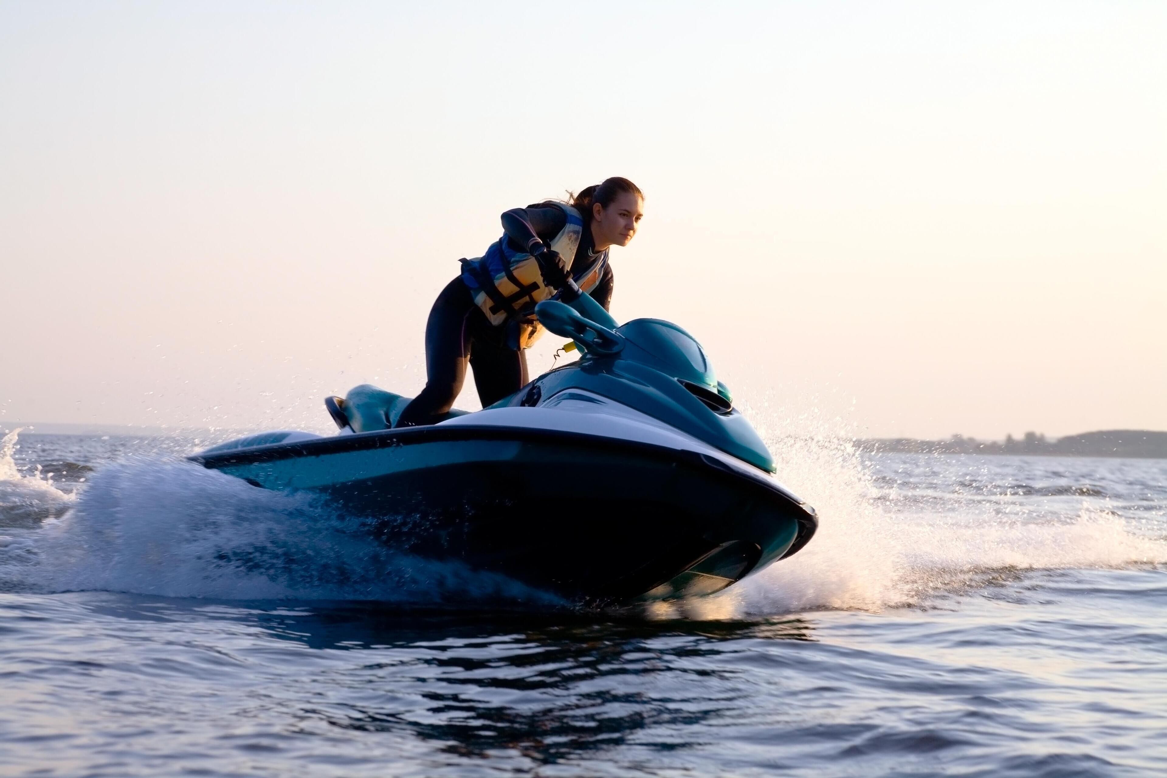 A person riding a jet ski on water.