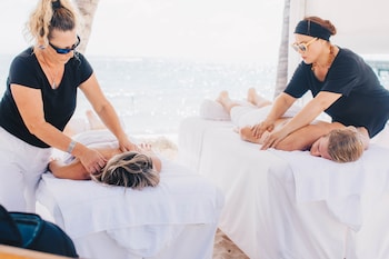 Outdoor treatment areas, hot stone massages, deep-tissue massages at The Reach Key West, Curio Collection by Hilton