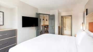 Desk, laptop workspace, blackout drapes, iron/ironing board