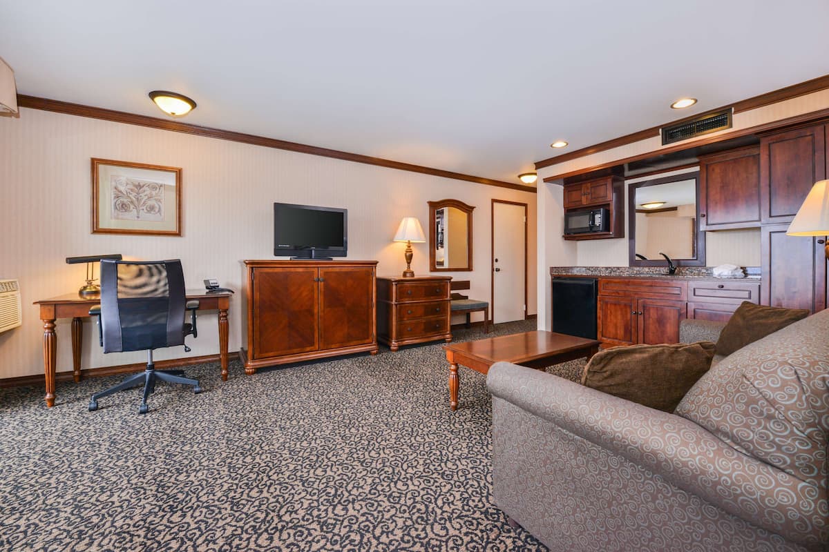 suite, 1 king bed, jetted tub, lake view | 1 bedroom, in-room safe, desk, blackout curtains