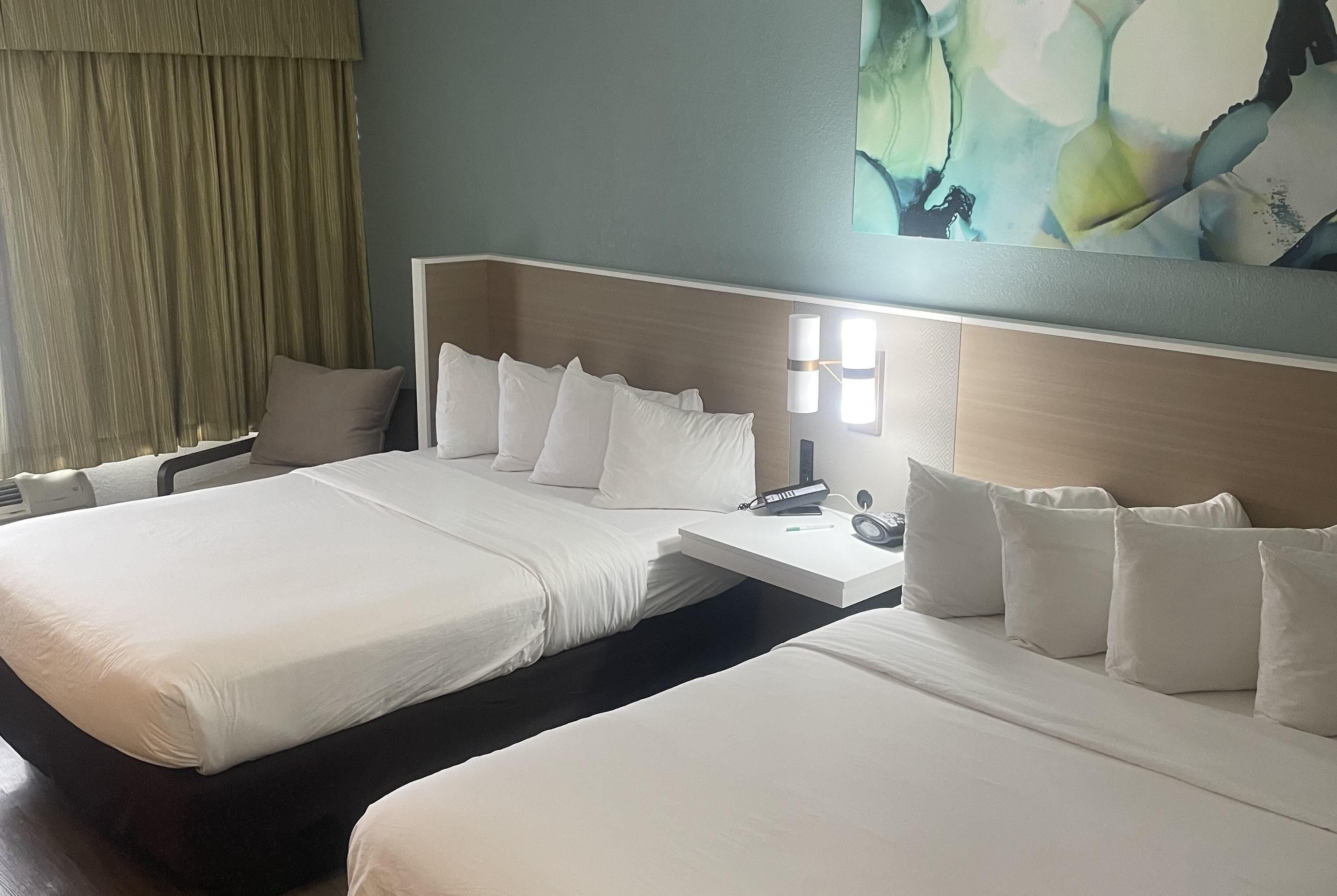 Premium bedding, pillow-top beds, desk, blackout curtains