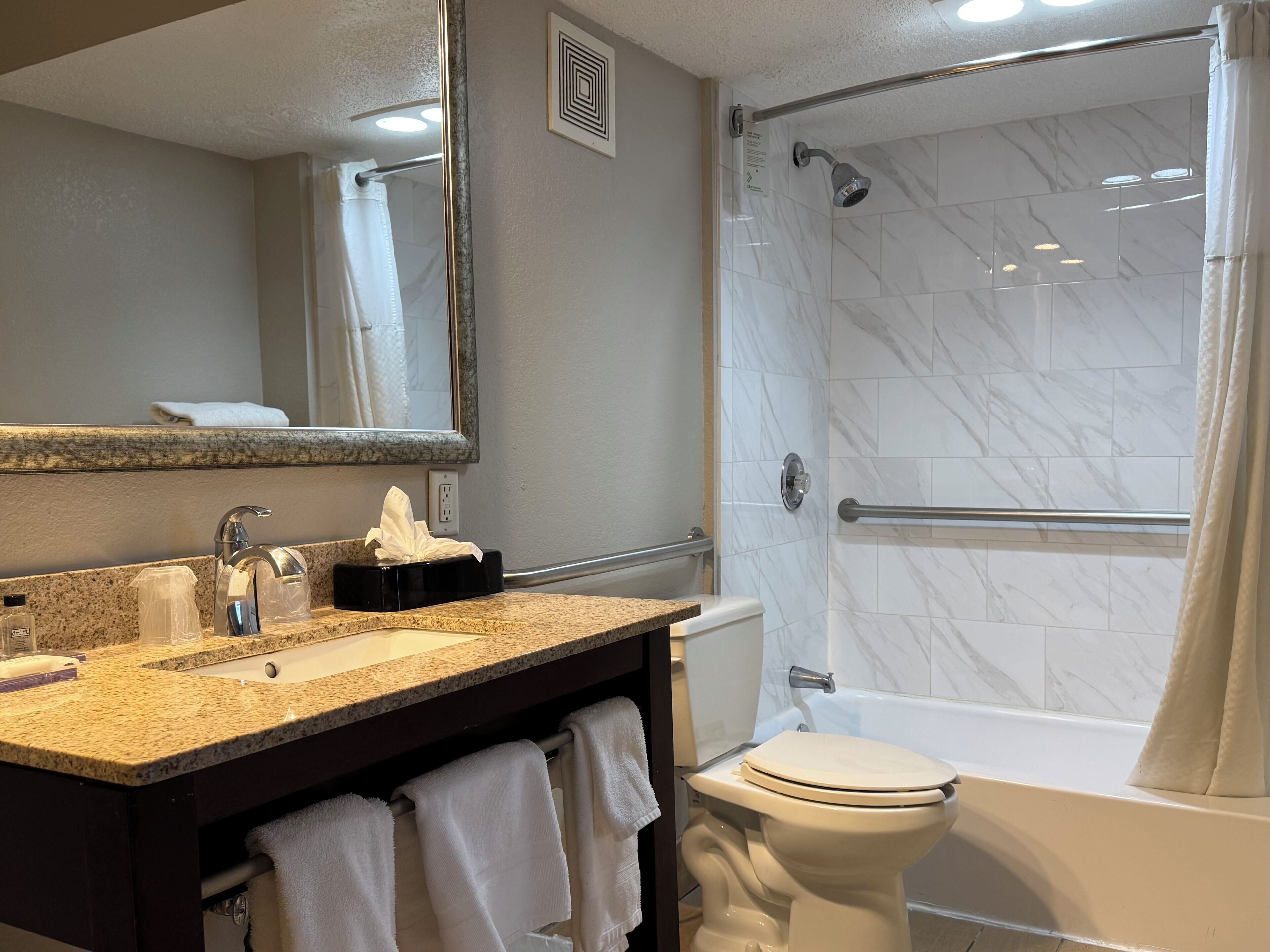 Room, 1 King Bed, Accessible, Non Smoking (Exterior Corridor) | Bathroom | Free toiletries, hair dryer, towels, soap