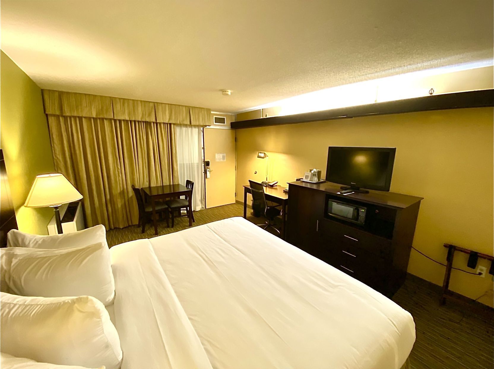 Premium bedding, pillow-top beds, desk, blackout curtains