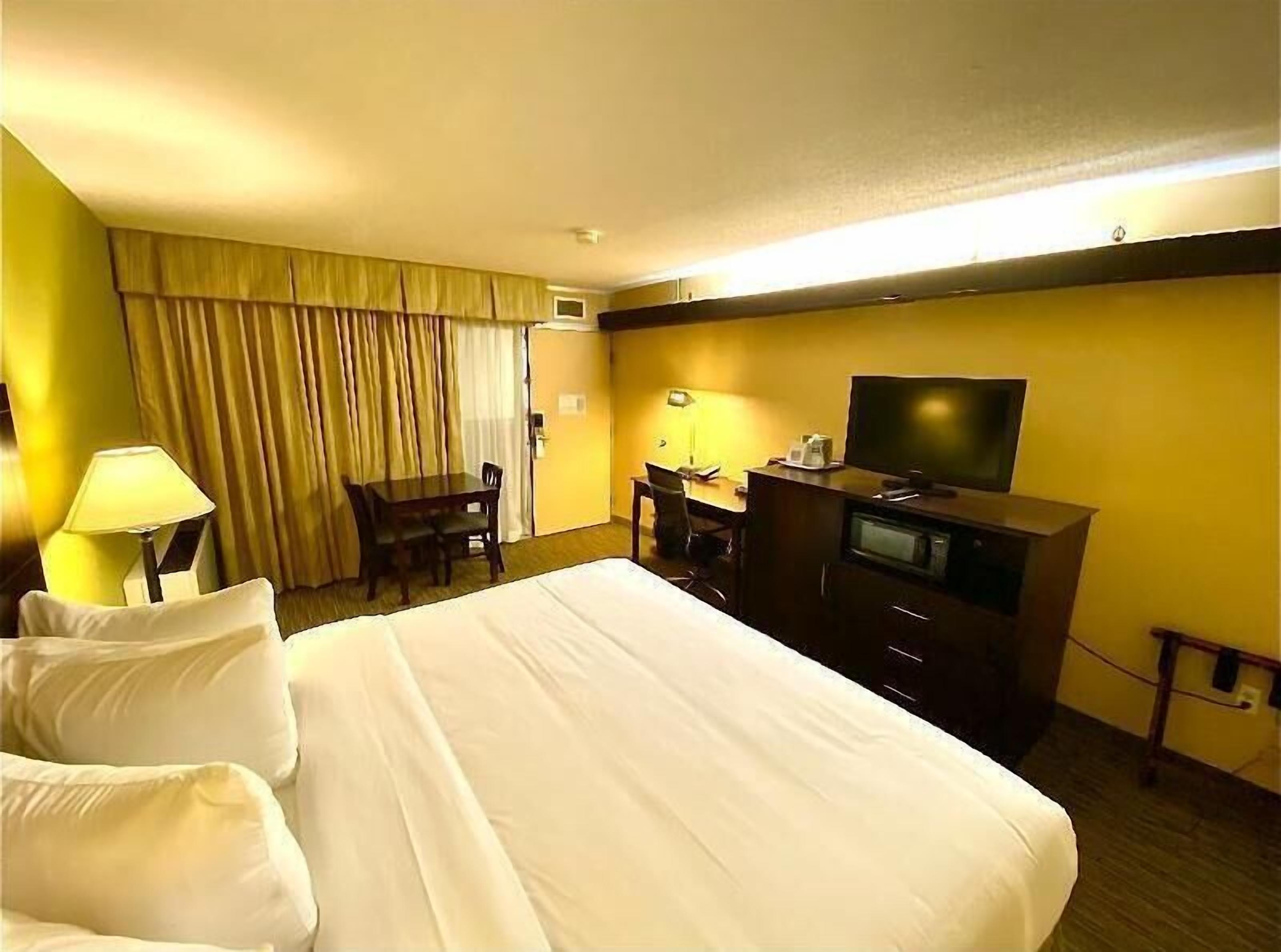 Premium bedding, pillow-top beds, desk, blackout curtains