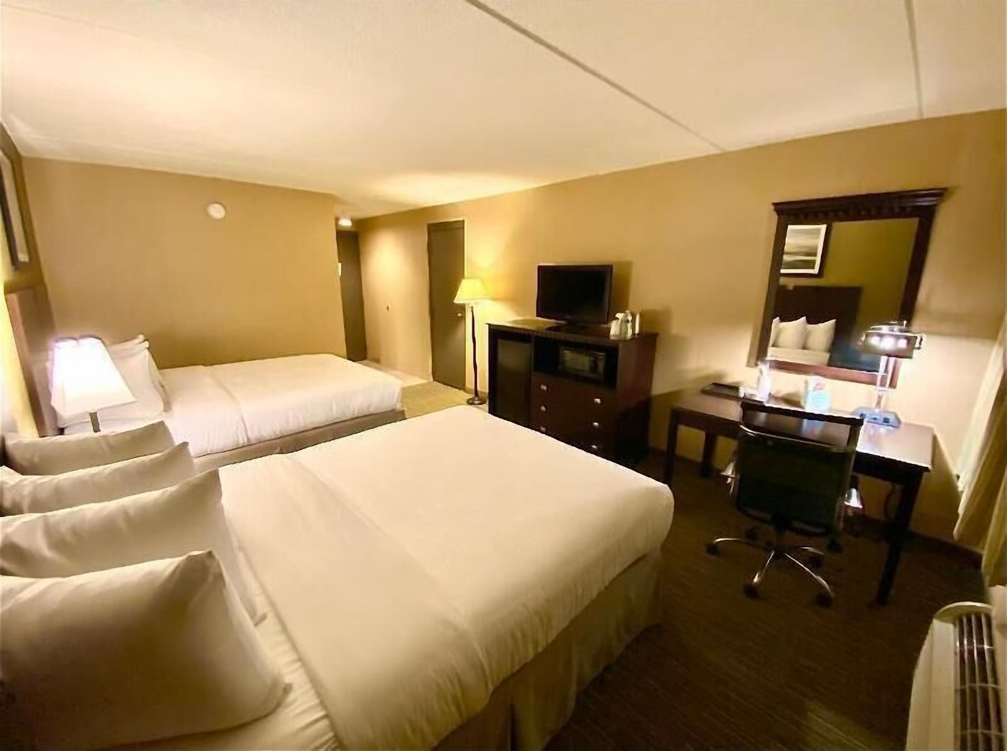 Premium bedding, pillow-top beds, desk, blackout curtains