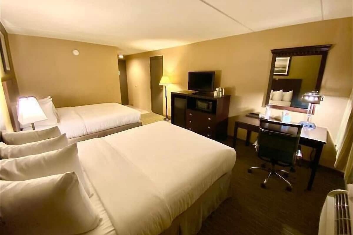 Premium bedding, pillow-top beds, desk, blackout curtains