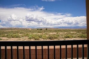 Escape to a serene landscape with breathtaking views of distant mountains.