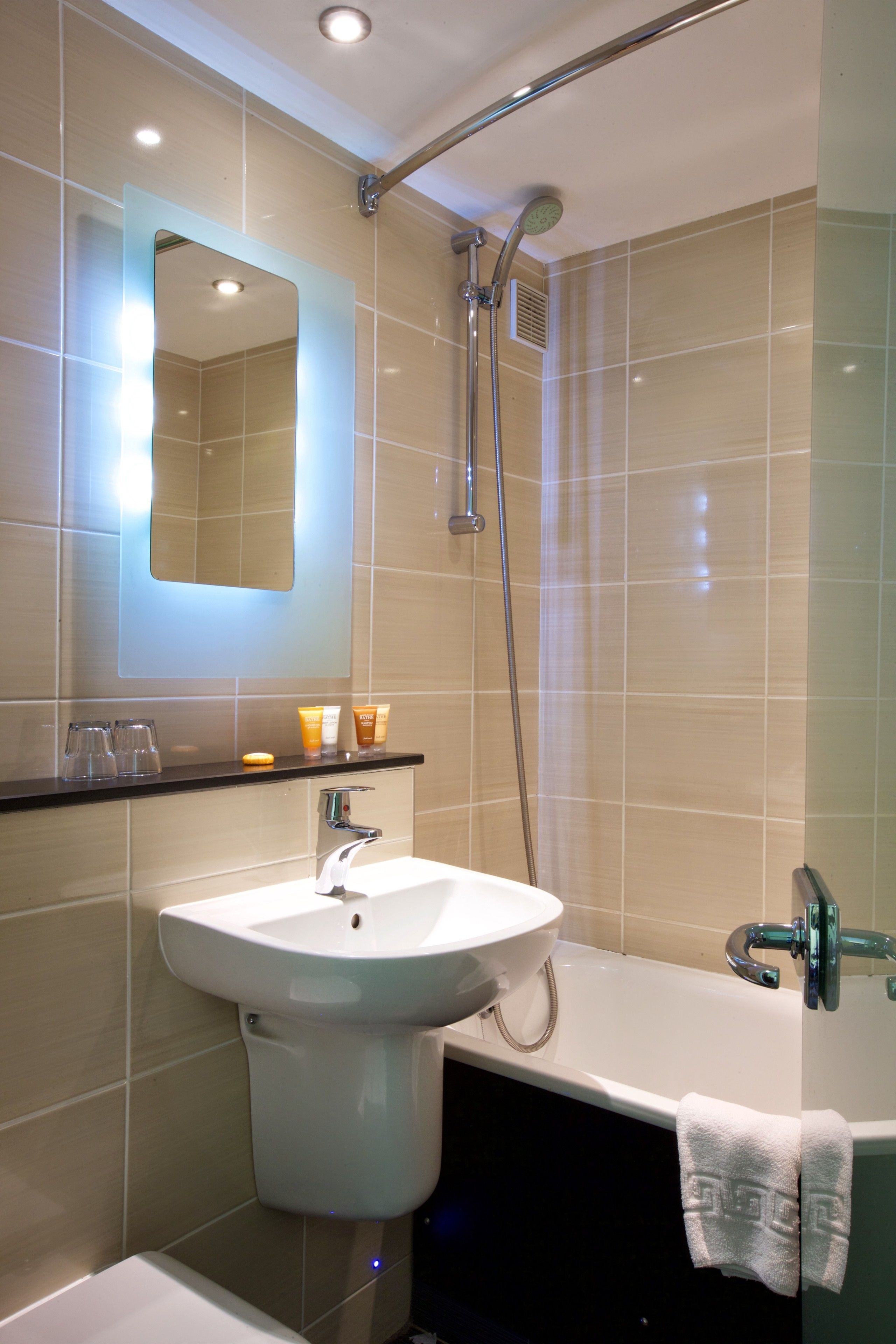 combined shower/bathtub, free toiletries, hair dryer, towels