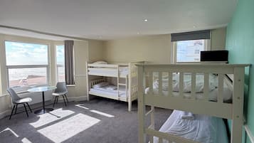 Quadruple Room, Multiple Beds, Sea View | In-room safe, iron/ironing board, travel crib, free WiFi