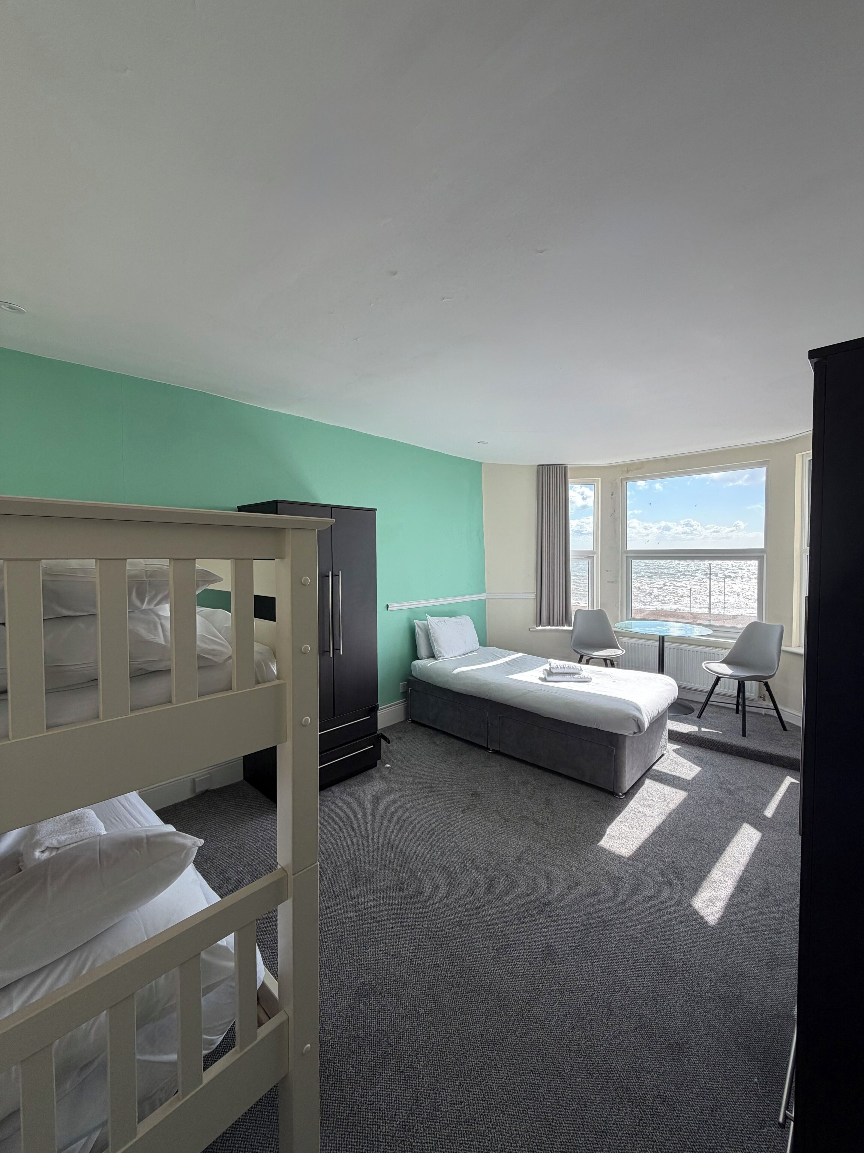 Triple Room, Multiple Beds, Sea View | In-room safe, iron/ironing board, free WiFi, bed sheets