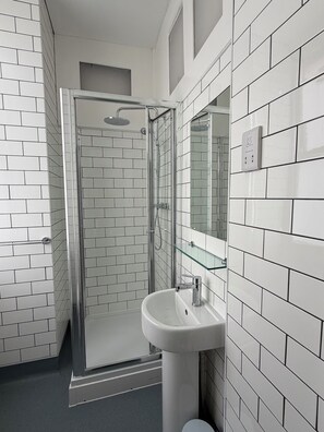 Rainfall showerhead, free toiletries, hair dryer, towels