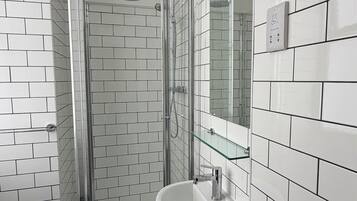 Rainfall showerhead, free toiletries, hair dryer, towels