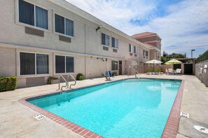 Seasonal outdoor pool, open 10:00 AM to 10:00 PM, sun loungers