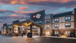 A hotel with a modern design, featuring a prominent sign for Best Western Plus.