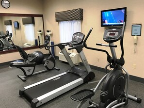 Stay active with our fully equipped fitness center featuring a treadmill, elliptical trainer, and stationary bike.