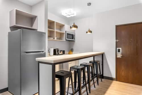 Executive Suite, 1 King Bed with Sofa bed, Non Smoking | Private kitchen | Mini-fridge, microwave, coffee/tea maker