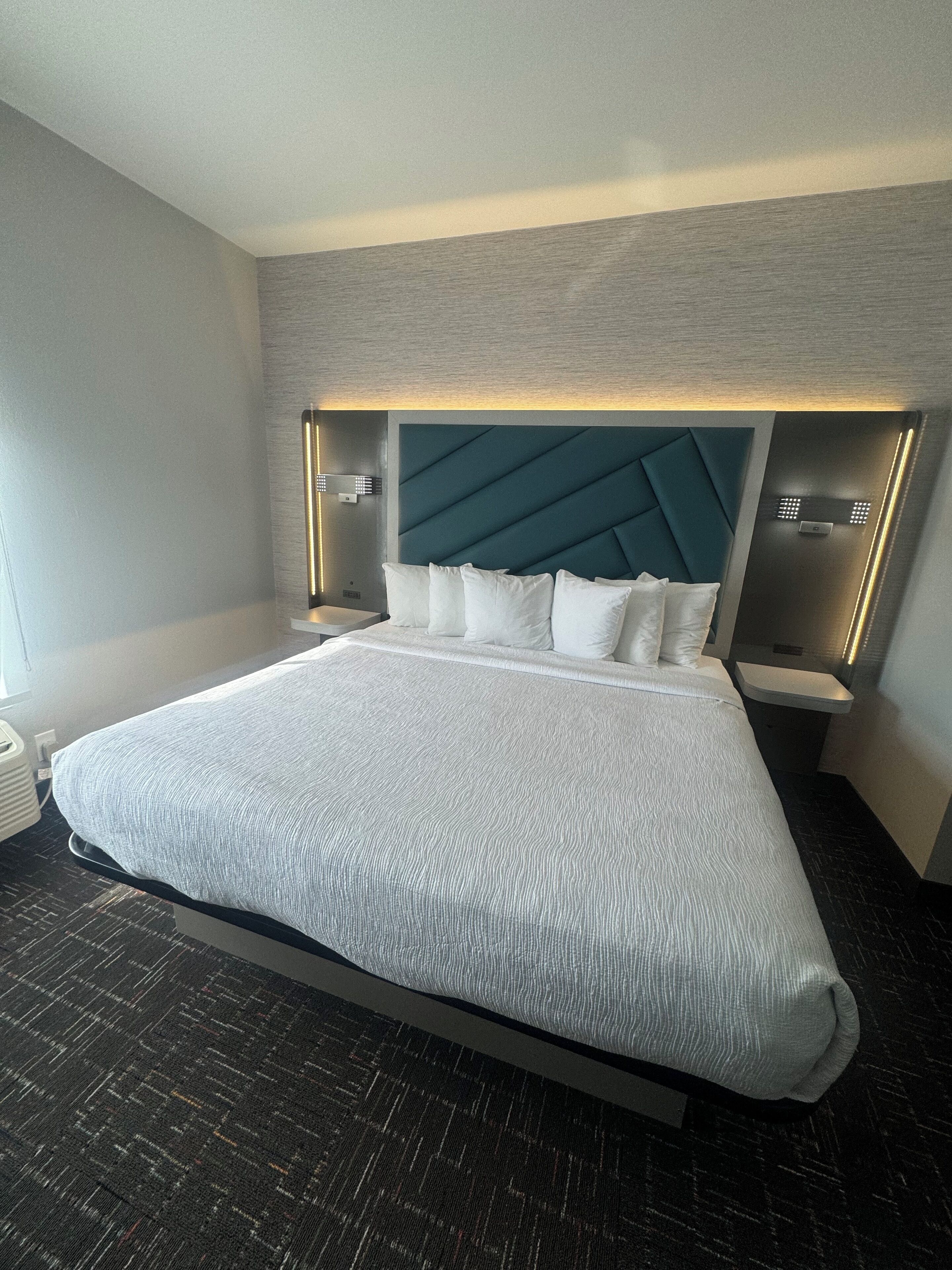 premium bedding, pillow-top beds, desk, laptop workspace