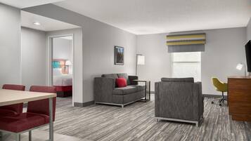 Suite, One King Bed, Non-Smoking | Living area | 55-inch TV with cable channels
