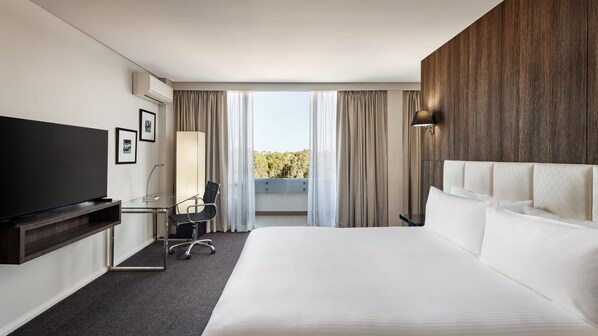 Enjoy a comfortable stay in this stylish room with a large bed, flat-screen TV, and desk area.