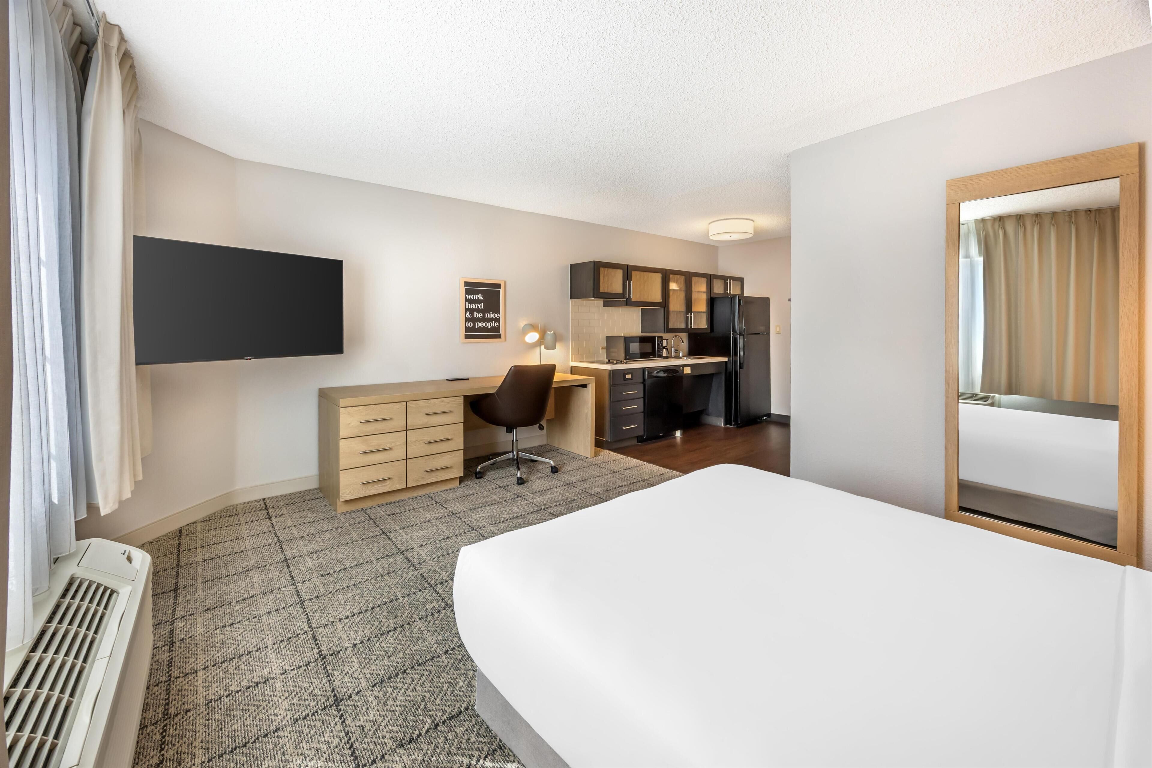 Desk, laptop workspace, blackout drapes, iron/ironing board