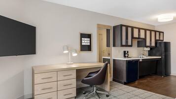 Desk, laptop workspace, blackout drapes, iron/ironing board