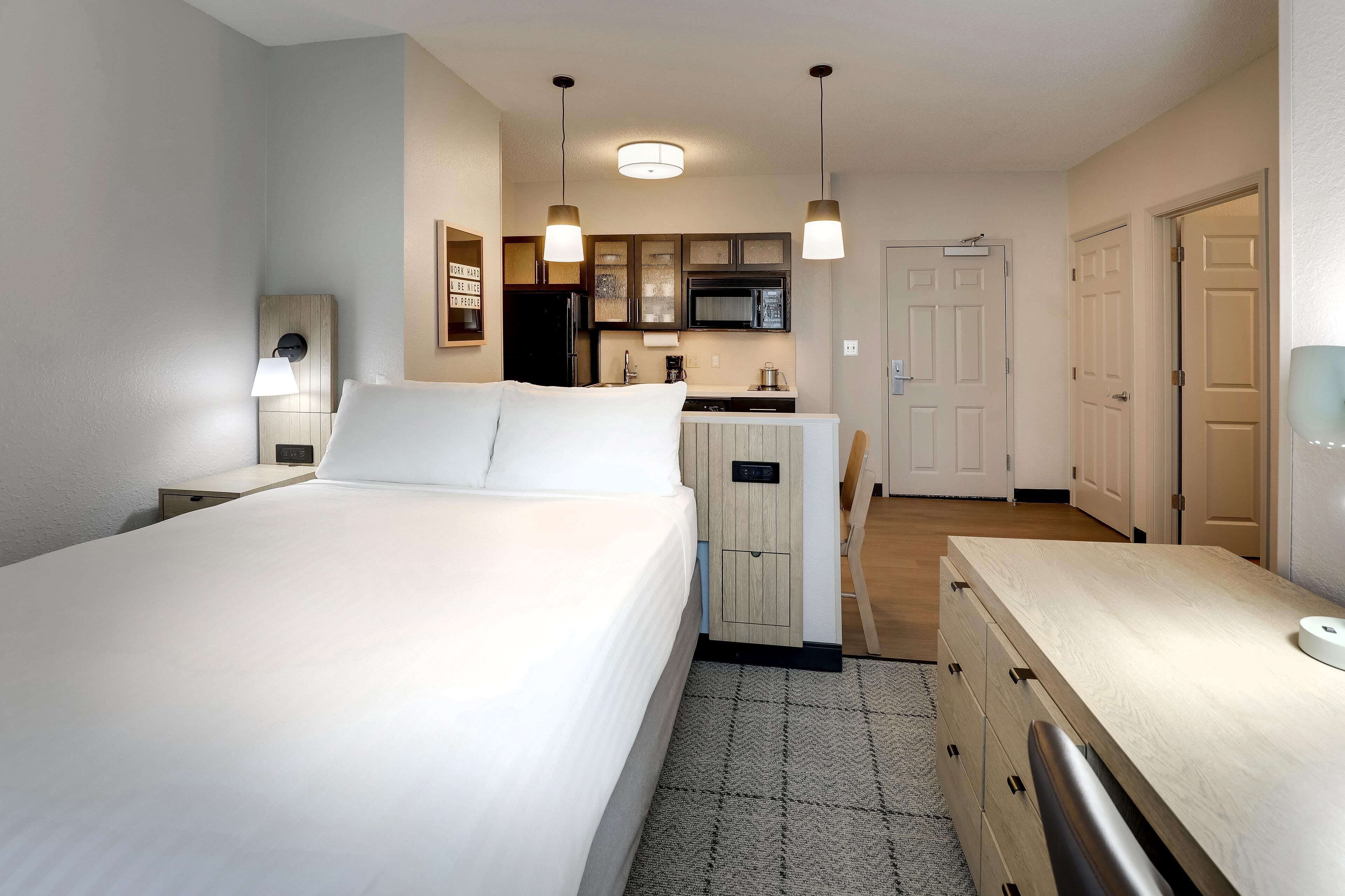 Suite, 2 Queen Beds (One Bedroom) | Desk, laptop workspace, blackout drapes, iron/ironing board