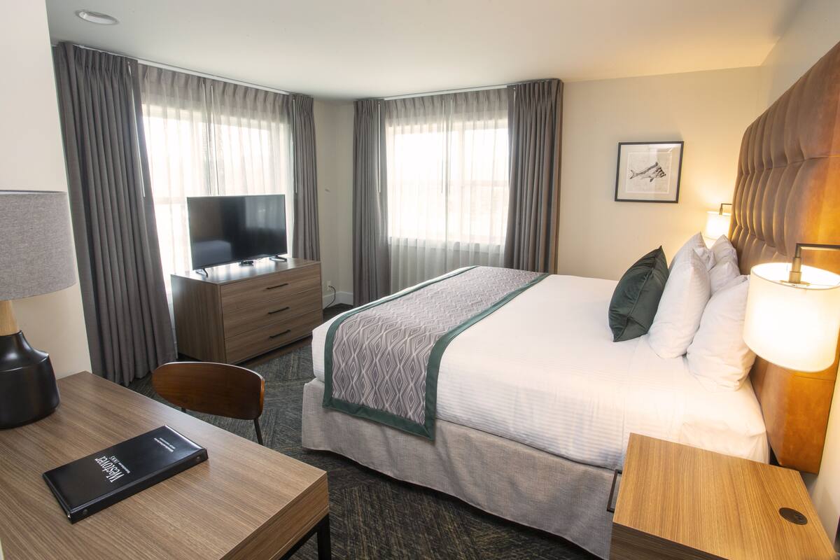 one bedroom suite with ocean view | desk, blackout curtains, iron/ironing board, free wifi