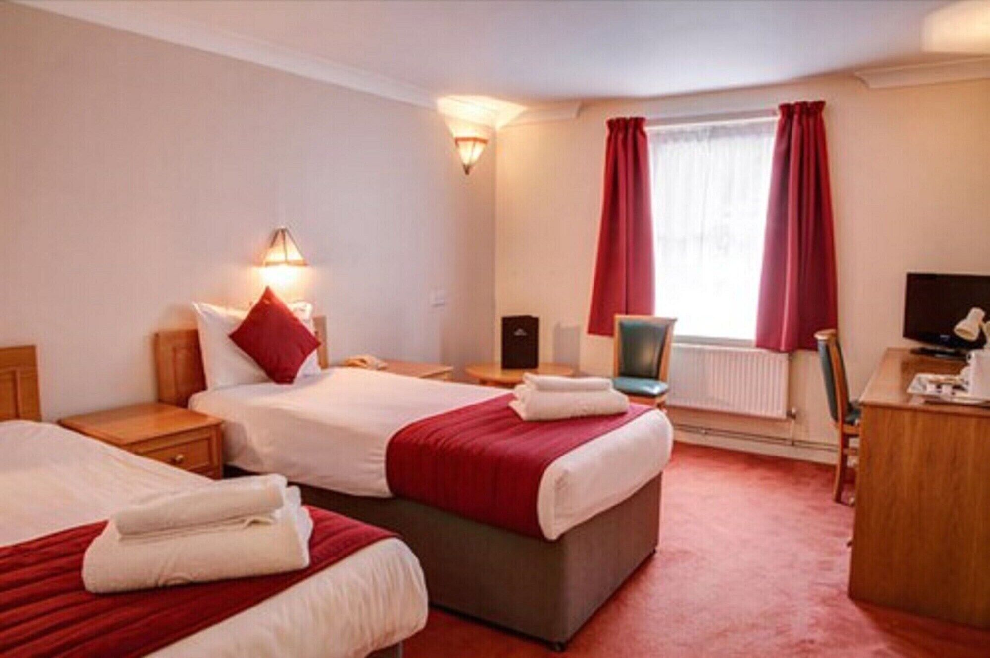 Desk, iron/ironing board, cribs/infant beds, free rollaway beds