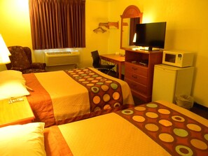 Desk, laptop workspace, bed sheets