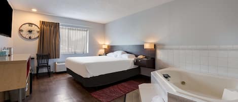 Room, 1 King Bed, Jetted Tub | Individually furnished, free cots/infant beds, rollaway beds, free WiFi