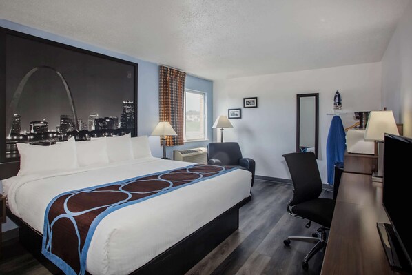 A hotel room with a large bed, a desk, a chair, a TV, and a cityscape view. - Super 8 by Wyndham Washington (Washington)
