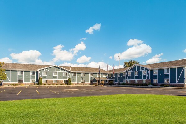 Simple, functional design with a spacious parking lot and flat roof.
