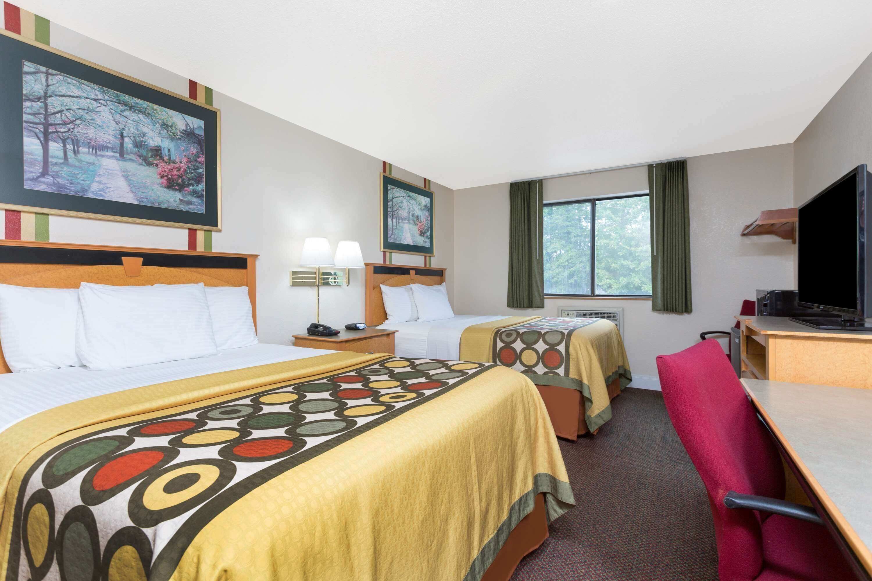 Desk, blackout drapes, iron/ironing board, rollaway beds