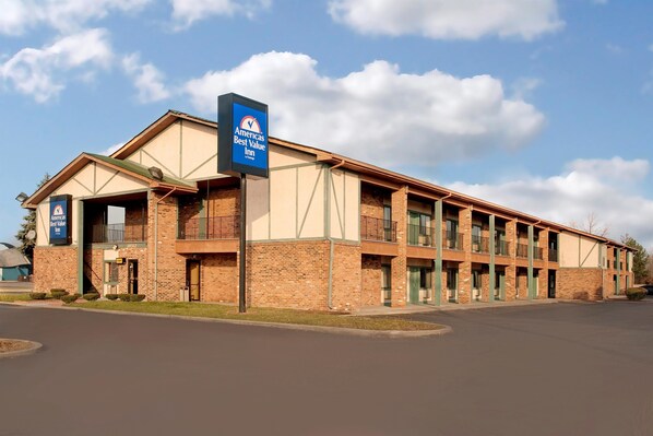 A two-story brick building with a sign for 'Americas Best Value Inn'. - Americas Best Value Inn Livonia Detroit (Livonia)