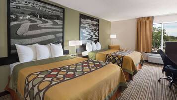 A hotel room with two beds, large landscape paintings, a desk with a chair, and a large window with curtains.