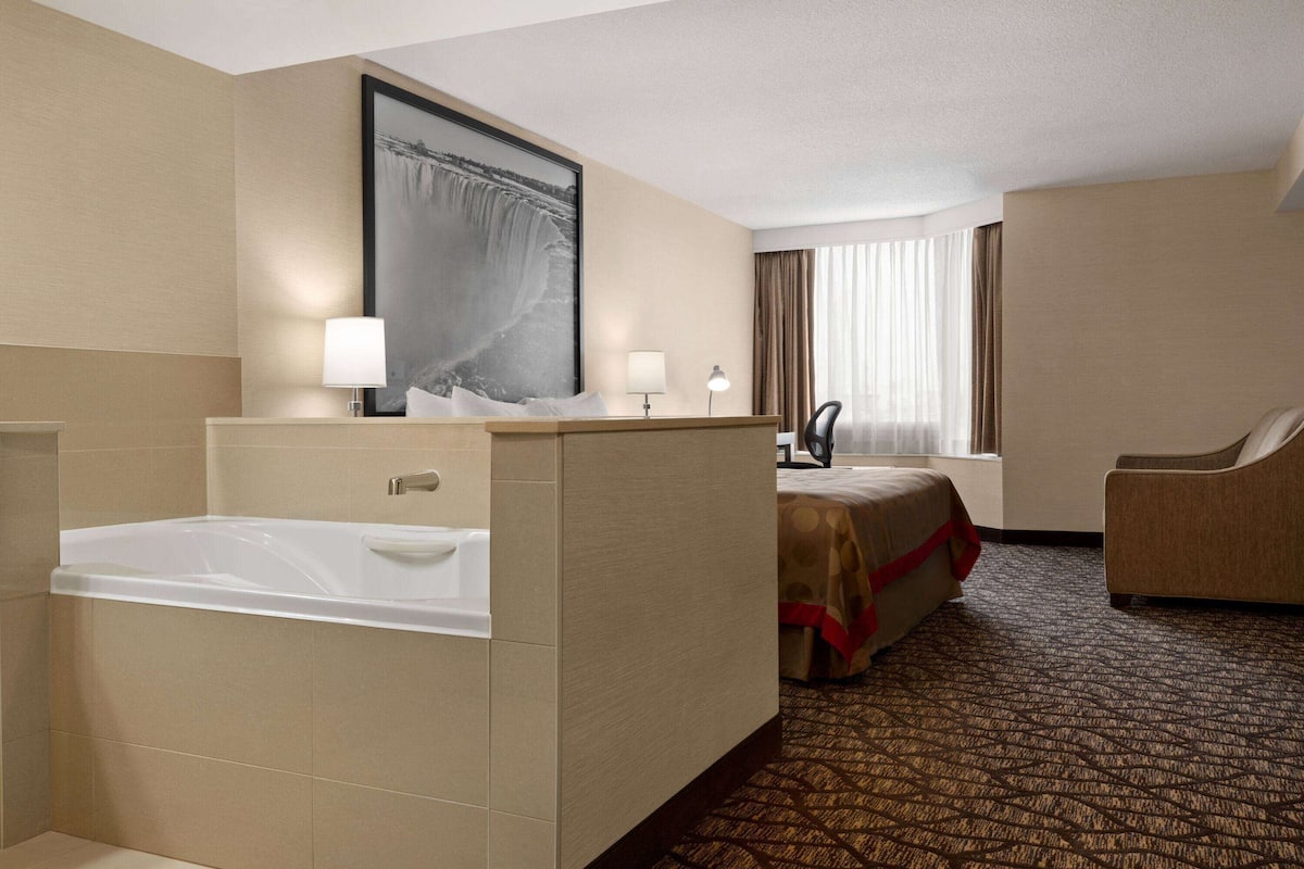 Basic Suite, 1 King Bed, Non Smoking, Jetted Tub | 1 bedroom, desk, iron/ironing board, free cribs/infant beds