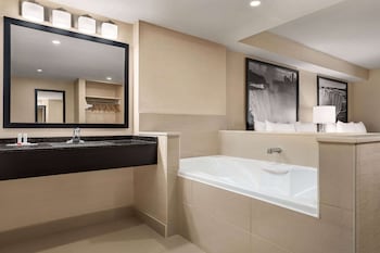 Eco-friendly toiletries, hair dryer, towels at Ramada by Wyndham Niagara Falls Near the Falls